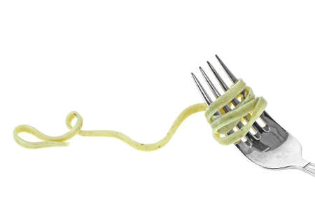 Green pasta tagliatelle on fork with swirl, on white backgroundの写真素材