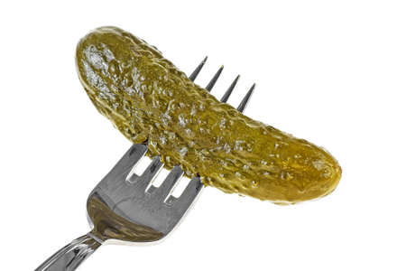Fork with pickled cucumber on a white backgroundの写真素材