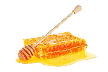 Sweet honeycomb and wooden dipper isolated on white background