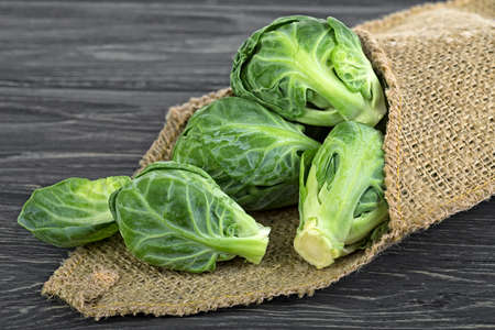 Brussels sprouts cabbage on old wooden table