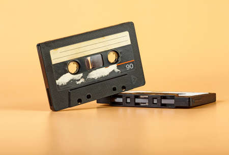 Two vintage audio cassette on brown backgroundの写真素材