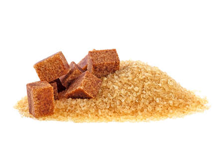Brown sugar cubes and crystal sugar on white backgroundの写真素材