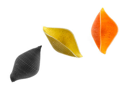 Conchiglioni. Big Italian pasta shells for stuffing on a white background. Top view.