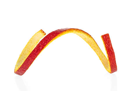Sicilian orange peel on a white background. Orange zest spiral.