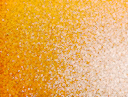 Yellow glitter abstract bokeh pattern. Christmas background.の写真素材