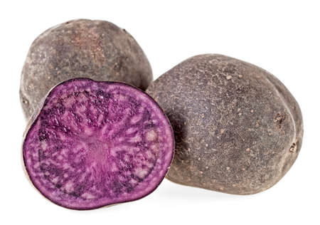 Fresh vitelotte potatoes isolated on a white backgroundの写真素材