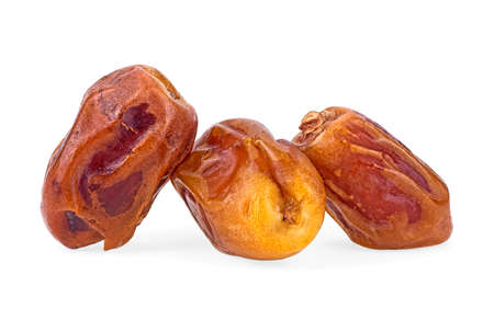Dried sweet dates isolated on a white backgroundの写真素材