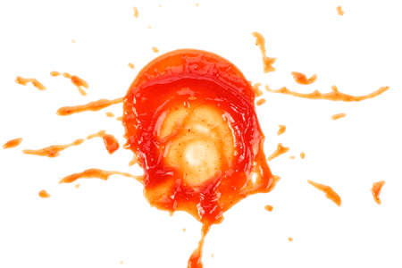 Red ketchup splashes isolated on a white background, top view.の写真素材