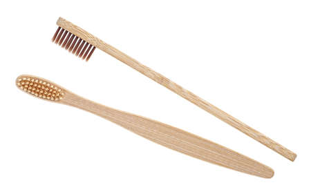 Bamboo toothbrushes isolated on a white background. Two different wooden toothbrushes.の写真素材