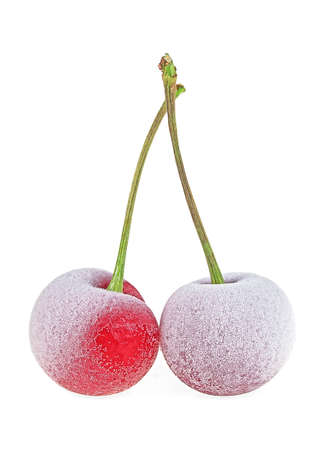 Two frozen cherries isolated on a white backgroundの写真素材