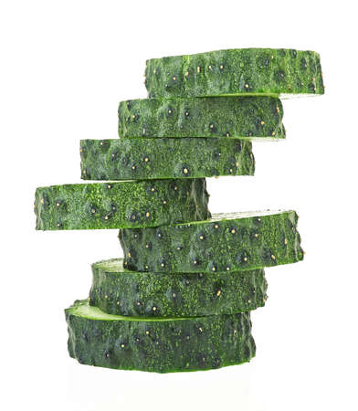 Fresh cucumber slices isolated on a white background. Tower.の写真素材