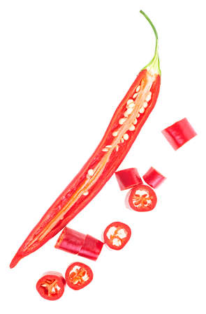 Half of red chilli pepper with slices isolated on a white background, top view.の写真素材