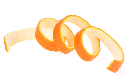 Peel of ripe orange isolated on a white background. Orange zest spiral. Single orange peel.の写真素材