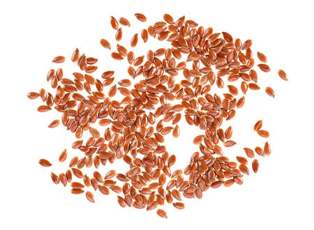 Dried flax seeds isolated on a white background. Top view linseeds.の写真素材