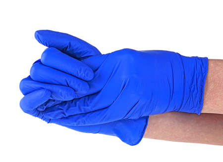 Hands of a medic wearing a blue latex gloves. Medical gloves. Surgical glove. Covid-19 prevention concept.の写真素材