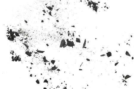 Charcoal dust with fragments isolated on a white background, top view.の写真素材