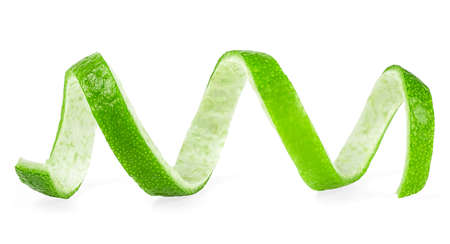 Peel of green lime on a white background. Lime twist.の写真素材