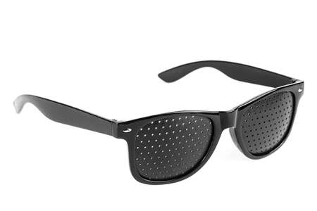 Perforated glasses isolate on a white background. Special glasses with holes for vision, pinhole glasses.の写真素材