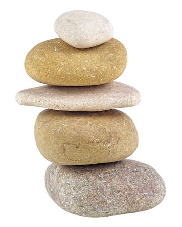 Pebble stones isolated on a white background. Pyramid of the stones. Balanced Zen stones.の写真素材