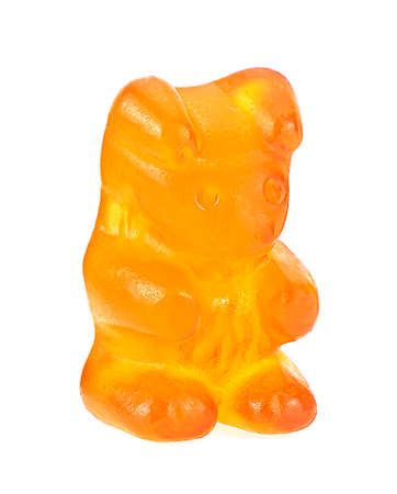 Yellow jelly gummy bear isolated on a white background. Jelly candy.の写真素材
