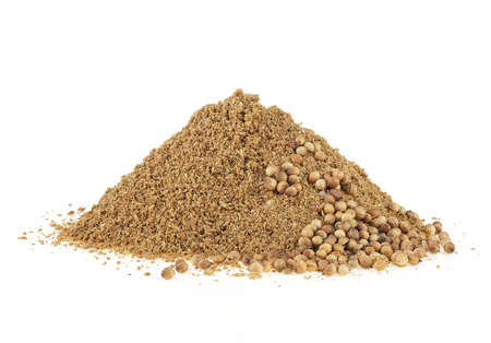 Indian spices - Coriander powder and seeds isolated on a white background.の写真素材