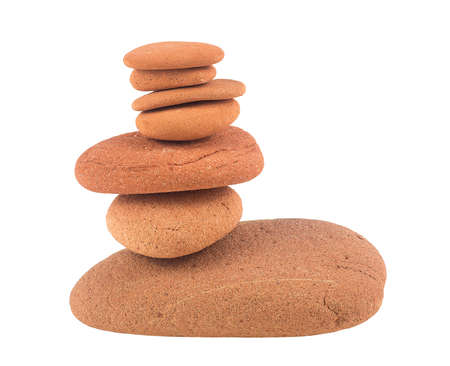 Balance red stones isolated on a white background. Zen stones. Spa concept.の写真素材