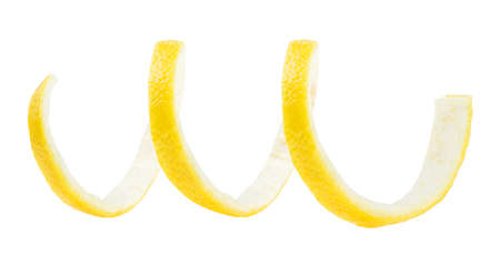 Spiral of lemon skin - Citrus twist peel isolated on a white background. Lemon zest.の写真素材