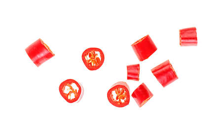 Red chopped chili peppers isolated on a white background, top view.の写真素材