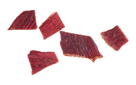 Spices beef jerky pieces isolated on a white background, top view. Dried meat.の写真素材