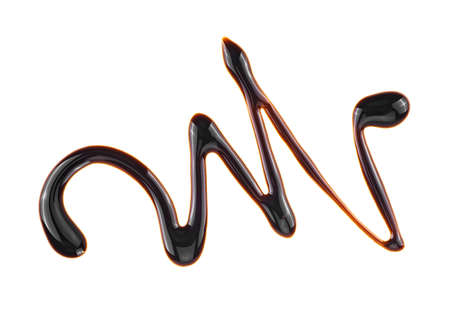 Splashes of sweet chocolate sauce. Chocolate syrup isolated on a white background. Liquid chocolate.の写真素材