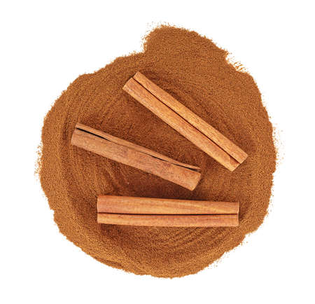 Cinnamon sticks and powder isolated on a white background, top view. Cassia cinnamon sticks.の写真素材