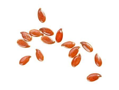 Close up of brown flax seeds isolated on a white background, top view.の写真素材