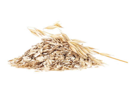 Oat spike with oat flakes isolated on a white background. Healthy food.の写真素材