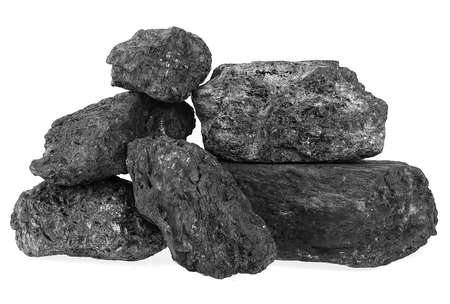 Pile of black coal isolated on a white background. Industrially mined coal.の写真素材