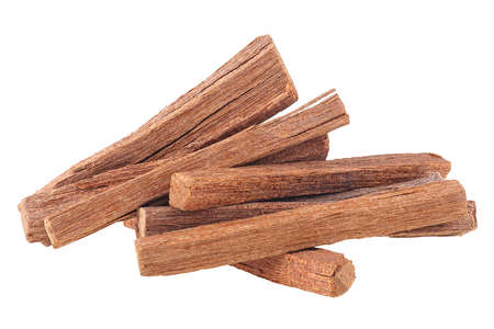 Pile of sandalwood sticks isolated on a white background. Chandan or sandalwood.の写真素材