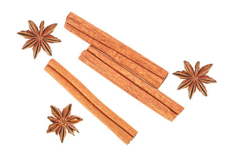 Anise and cinnamon sticks isolated on a white background, top view.の写真素材
