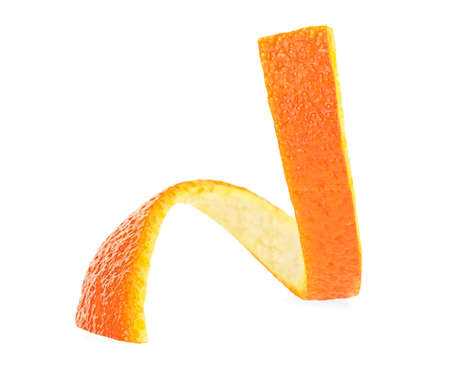 Orange zest spiral. Aromatic orange peel isolated on a white background. Ingredient for infusions and liqueurs.の写真素材