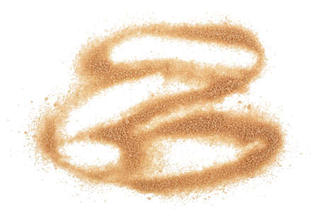 Pile brown sugar isolated on a white background. Crystals of brown cane sugar.の写真素材