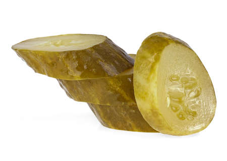Fresh sliced green pickled cucumbers isolated over white background. Marinated cucumber. Gherkins.の写真素材