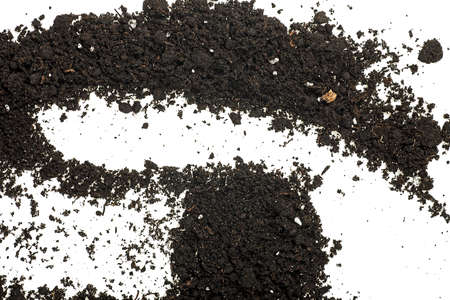 Pile heap of soil isolated on a white background, top view.の写真素材