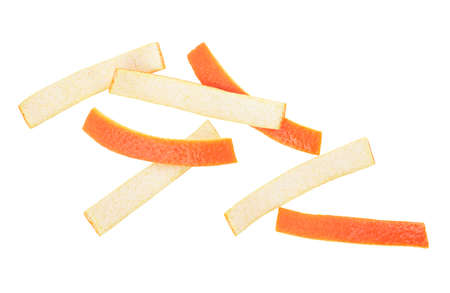 Pieces of orange peel isolated on a white background, top view.の写真素材
