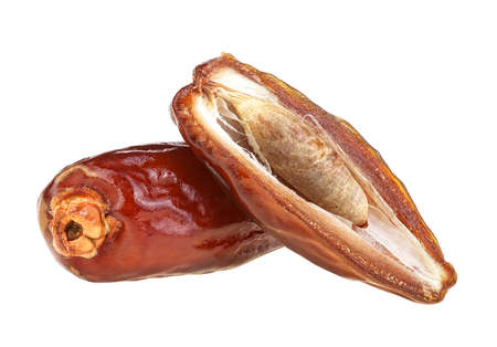 Dried sweet dates isolated on a white background. Date fruits, whole and half.の写真素材