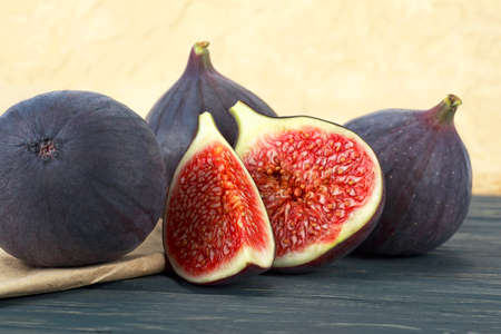 Fresh ripe figs on dark wooden table. Healthy mediterranean fig fruits. Sweet fresh organic figs.の写真素材