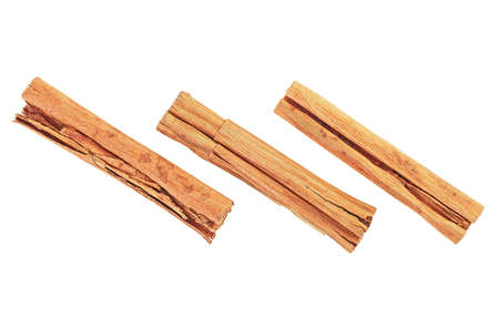 Close up of cinnamon sticks isolated on a white background, top view. Three cinnamon sticks. Ceylon cinnamon.の写真素材
