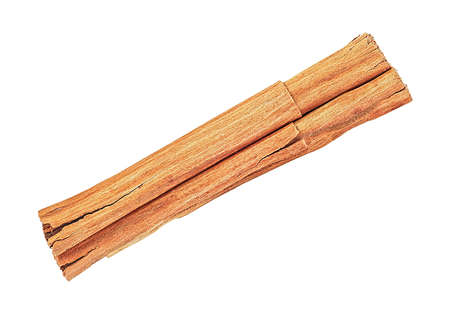 Close up of single cinnamon stick isolated on a white background, top view. Ceylon cinnamon.の写真素材