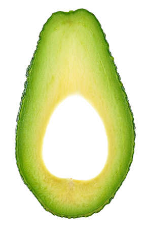 Slice of ripe avocado isolated on a white background, top view.の写真素材