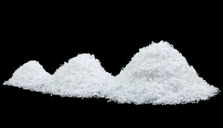 Pile of white snow isolated on black background. Close up image of white snow. Snowflakes on a black background.の写真素材
