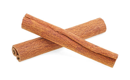 Two sticks of cinnamon isolated on a white background. Delicious cinnamon sticks.の写真素材