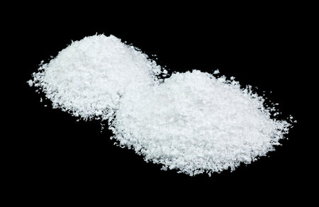 Snow on a black background, close-up. Snow hills. Heap of snow.の写真素材