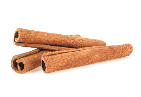 Aromatic cinnamon sticks isolated on a white background. Three cinnamon sticks.の写真素材